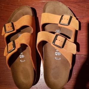 Orange and white Birkenstocks